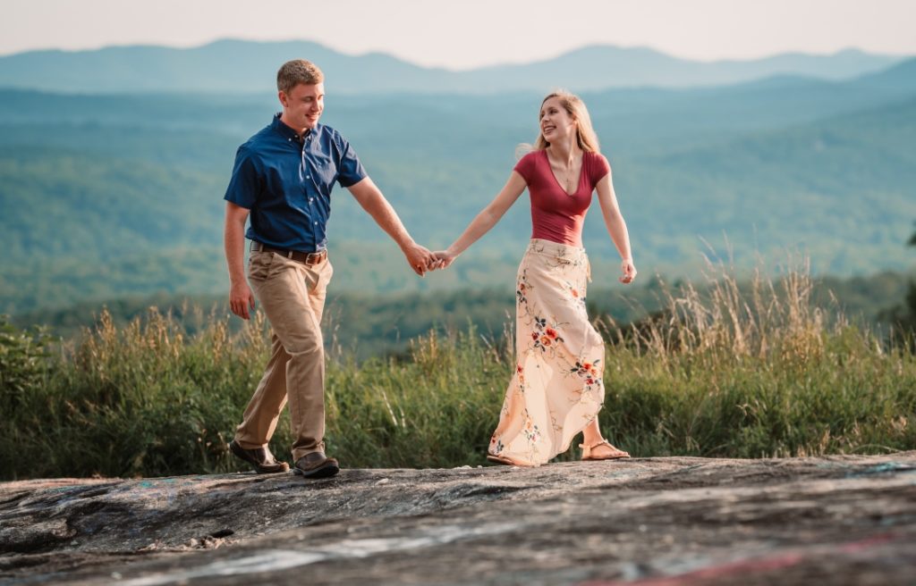 A cute couple enjoying their elopement on a mountain top in the best places to elope in north carolina