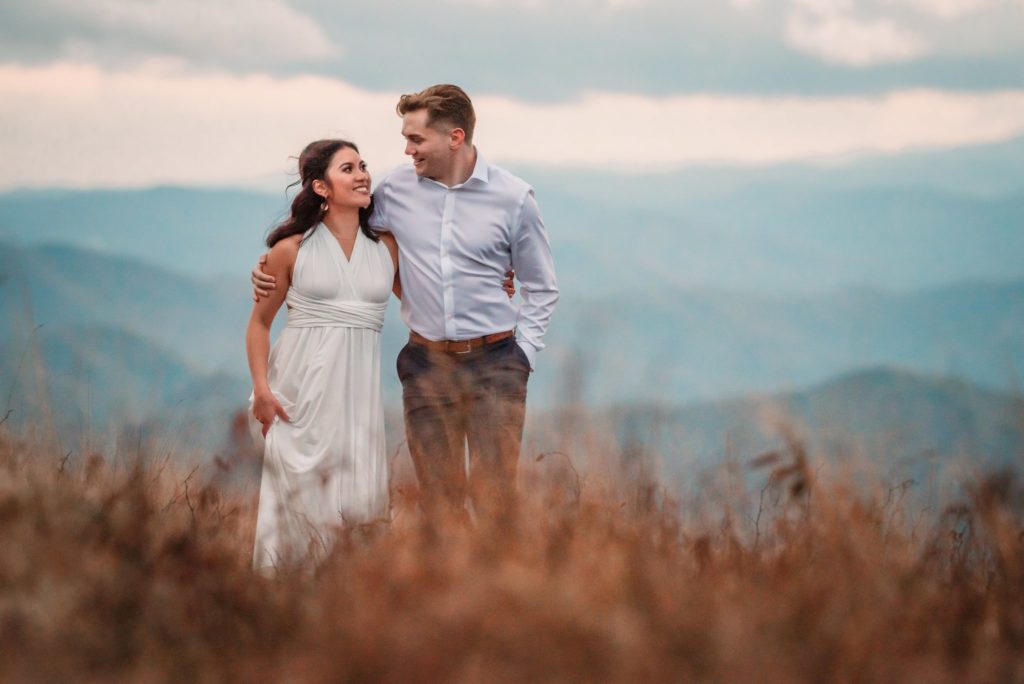 a sunny roan mountain elopement with the bride and groom walking away