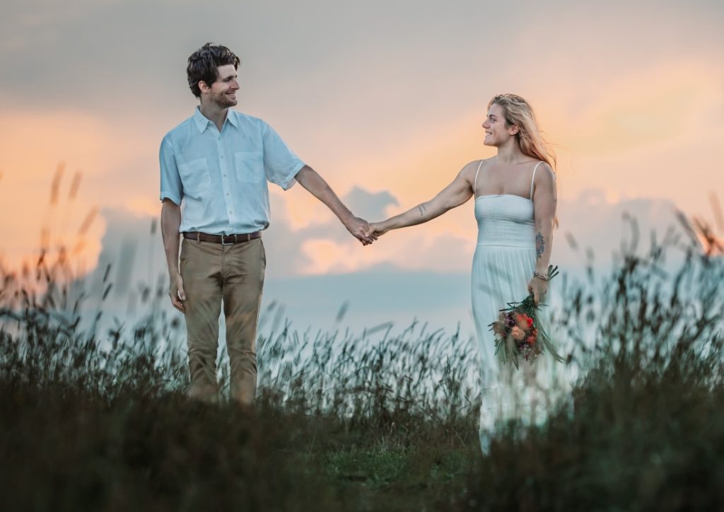 two people standing together and arm's length apart at their max patch elopement
