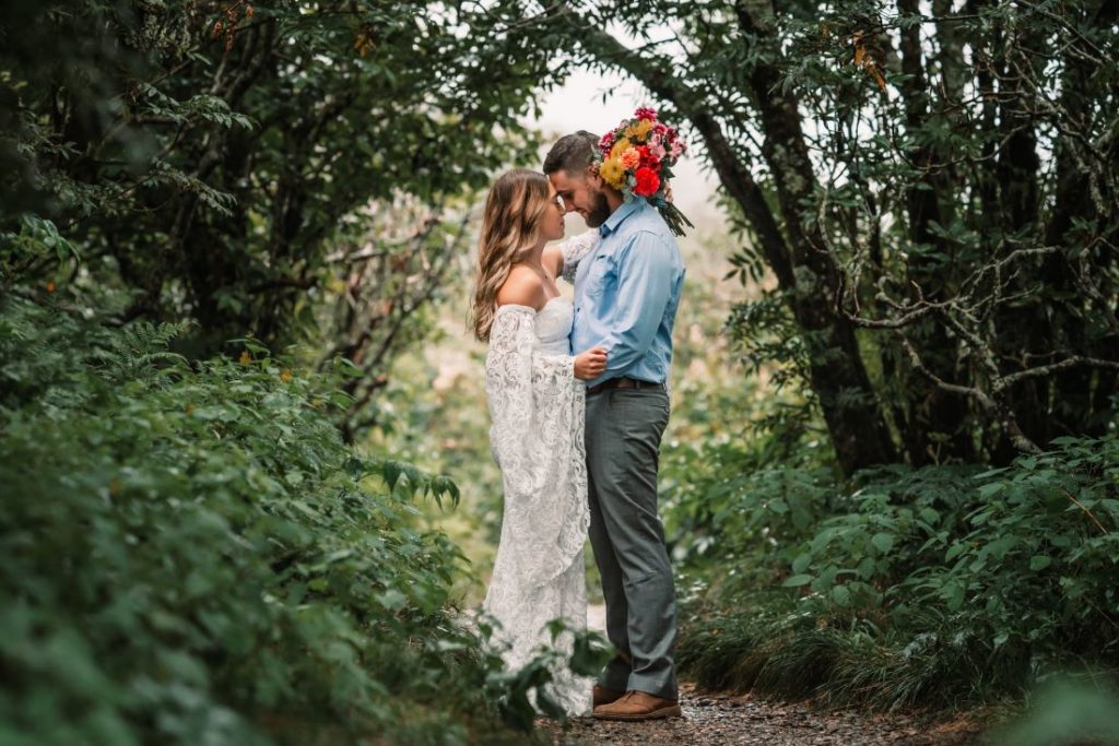 a man and woman enjoy being married at their craggy gardens elopement