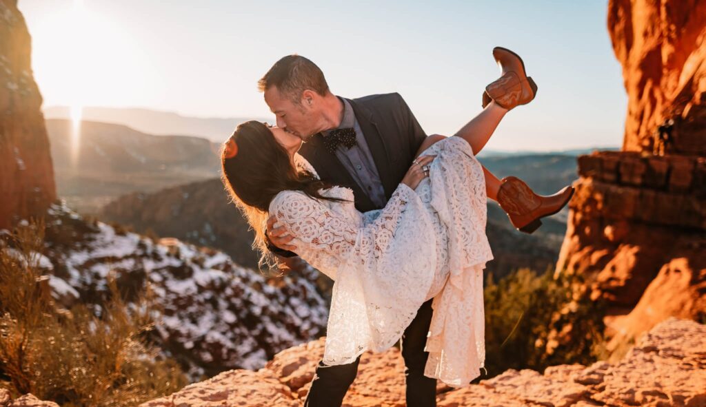 a happy couple eloping in sedona in the red rocks
