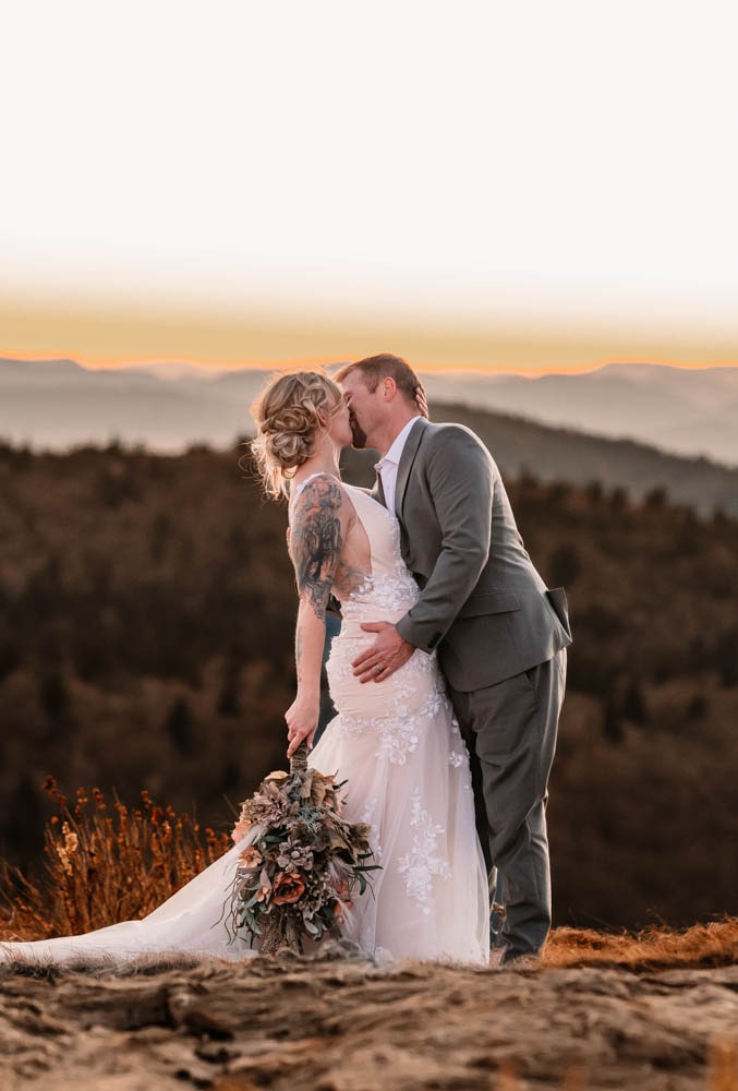 couple eloping in north carolina by a pretty waterfall